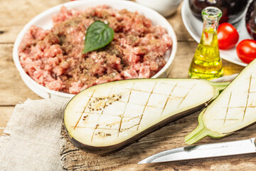 Stuffed eggplant ready to bake with ground meat, vegetables, and spices