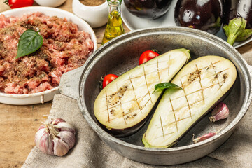 Stuffed eggplant ready to bake with ground meat, vegetables, and spices