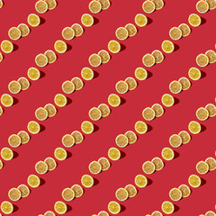 Summer composition made from lemon, Lemon slice on red background. Creative Pattern made of slices of lemon. Flat lay, top view of colorful fruit pattern of fresh lemon slices.