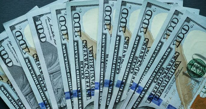 Background with American one hundred dollar bills. Looped stop motion animation