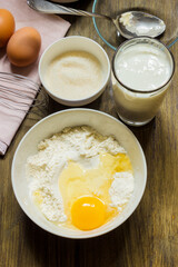 Dough for cooking pancakes on kefir. Eggs, flour, a glass of kefir, sugar, salt. Country style.