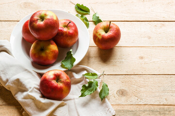 Ripe apples on wooden background. Free space for text.
