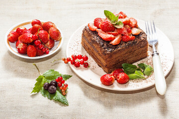 Homemade baking. Chocolate cake with strawberries and mint.