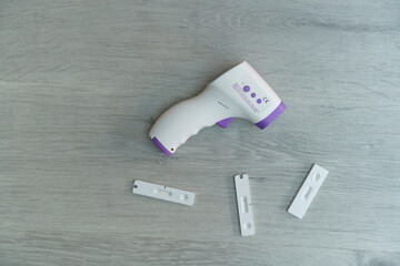 Covid-19 antigen test with negative results and thermometer