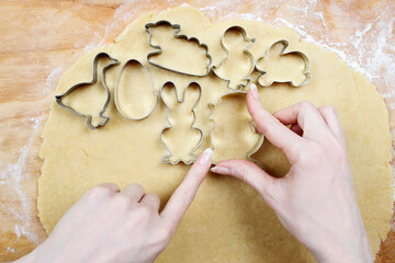 Preparing easter gingerbread cookies. Steps of making pastry.