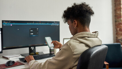 African american trader using smartphone for cryptocurrency swap