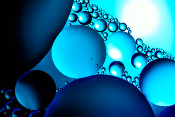 Bubbles of oxygen in water. Water structure. Blue abstract water bubbles texture background.