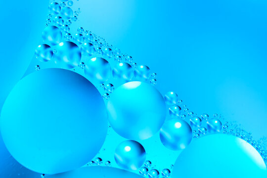 Bubbles of oxygen in water. Water structure. Blue abstract water bubbles texture background.