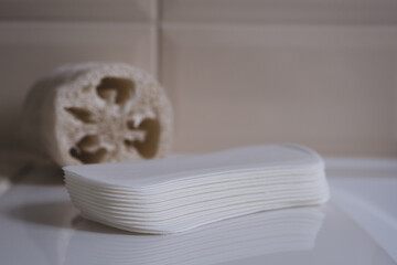 Female sanitary pads on the bathroom table. Feminine hygiene products