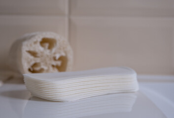 Fototapeta na wymiar Female sanitary pads on the bathroom table. Feminine hygiene products