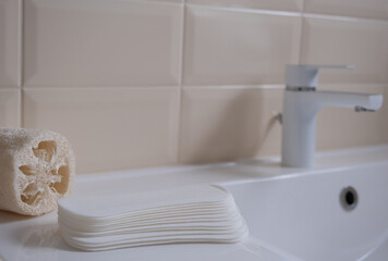 Female sanitary pads on the bathroom table. Feminine hygiene products