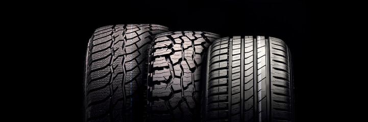 new mud tire for off-road cars SUV close-up tread on black background - obrazy, fototapety, plakaty