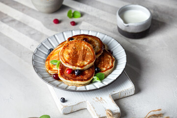 Classic pancake with maple syrup and berries