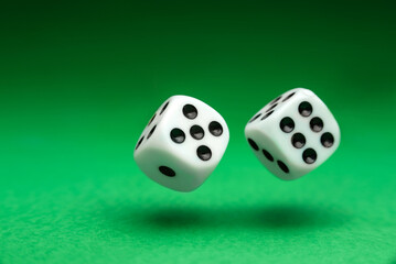dice thrown over the green table. Playing dice close up.