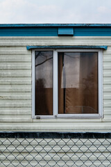 trailer or caravan window, concept photo for live in poverty.