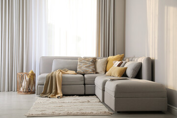 Living room interior with large grey sofa