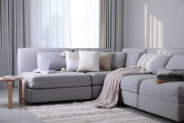 Living room interior with large grey sofa