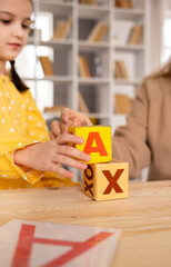 close-up of cubes with letters on the table in the room