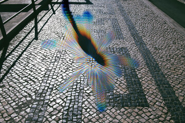 Metaverse digital silhouette shadow of person on the cobblestone road - conceptual reality imagination virtual and real world - cybersapce hypothesized iteration of the internet, supporting persistent