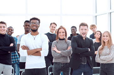 group of confident young people standing in a conference room