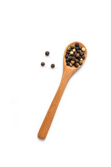 Black pepper in wooden bowl isolated on white background