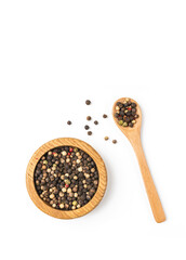 Black pepper in wooden bowl isolated on white background