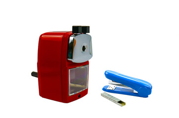 Side view of blue stapler and red metal pencil sharpenner on white background, Stationery office...