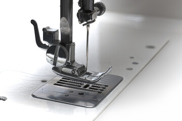 Closeup needle fixation metal foot sewing machine