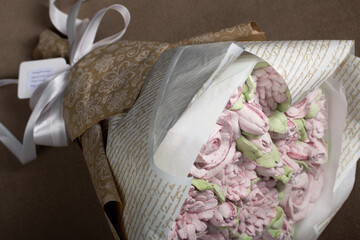 A bouquet of marshmallows. Zephyr flowers. Packed in craft paper.