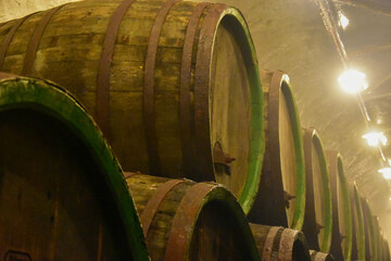 beer being brewed in an old oak barrel brewery