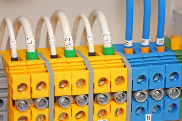 Electrical terminals for connecting wires in an electrical panel close-up.