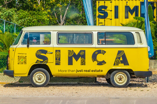 Typical colorful street road traffic cars palms of Tulum Mexico.