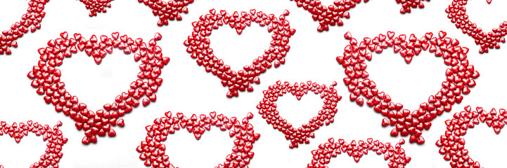 Valentine day isolated white background with red candies hearts. Concept of love, marriage, wedding, Valentine's day, passion. Top view. Banner.