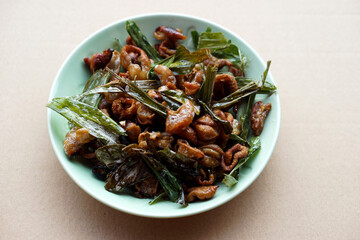 Crispy fried intestines and herbs on dish. Concept : Weird food. Delicious menu in Thailand. Best to eat with beer or eat as appetizer.                                 