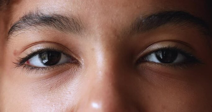 Close up cropped front face cute teenage African girl looks at camera and smiling. Young Z generation person, eye vision check up clinic services ad, attractive appearance, perfect skin view concept