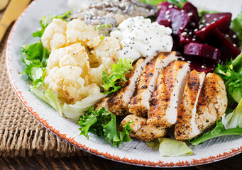 Healthy lunch. Boiled beetroot salad with greens, stewed mushrooms,  and grilled chicken fillet and baked cauliflower. Dinner.