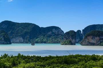 The scenic view of the mangrove forest and Ko Chong Lat island are located in Ao Luek District, Krabi, Thailand.