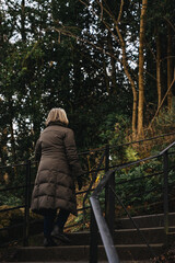 Fototapeta premium old woman in the forest.