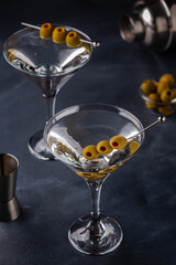 Martini cocktail on dark stone table.