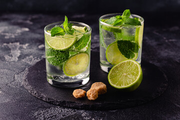 Refreshing summer alcoholic cocktail mojito with ice, fresh mint and lime