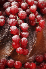 A cake with fresh red currant and tea