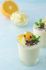 Orange lemon citrus milk mousse in glasses	