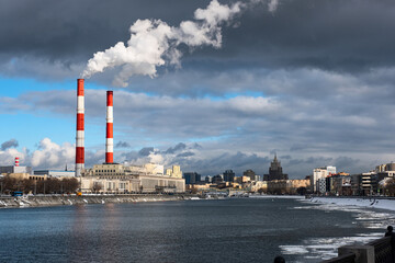 Moscow. Russia. Smoke from the pipes of heat station Riverside Station near the Moskva River, winter view. 