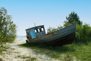 Old small boat lying on the beach