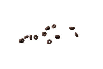 Chocolate rings cereal spill out into a bowl. Breakfast.