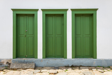 Fototapeta na wymiar three old green door