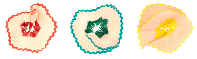 Set colored pencil shavings isolated on white background. closeup