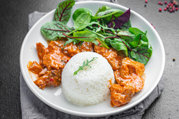 rice meat jambalaya and salad leaves lettuce mix fresh healthy meal food snack on the table copy space food background 