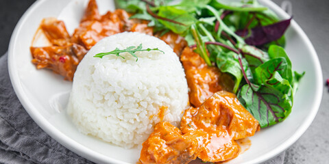 rice meat jambalaya and salad leaves lettuce mix fresh healthy meal food snack on the table copy space food background 