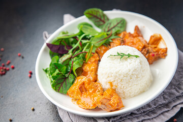 rice meat jambalaya and salad leaves lettuce mix fresh healthy meal food snack on the table copy space food background 
